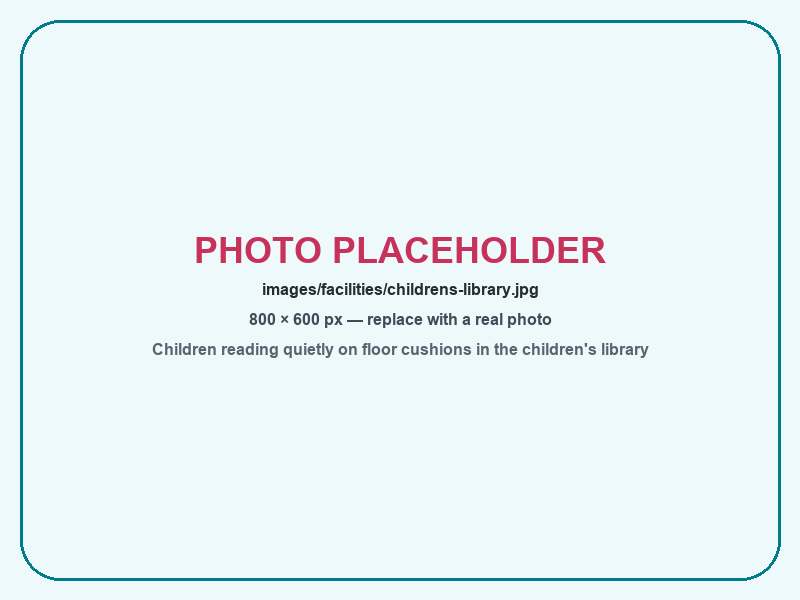Children reading quietly on floor cushions in the children's library