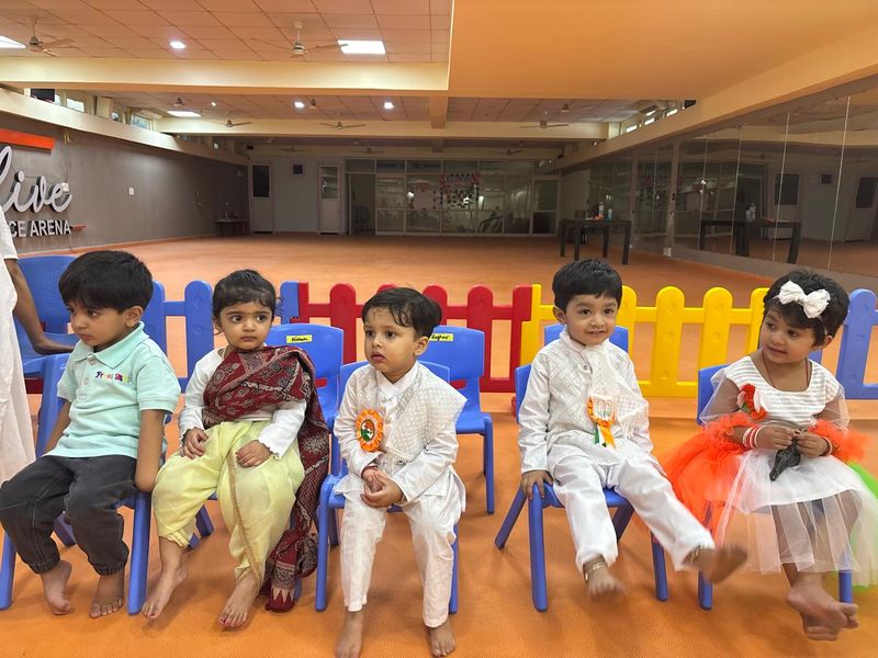 Older children seated together in the centre's activity hall